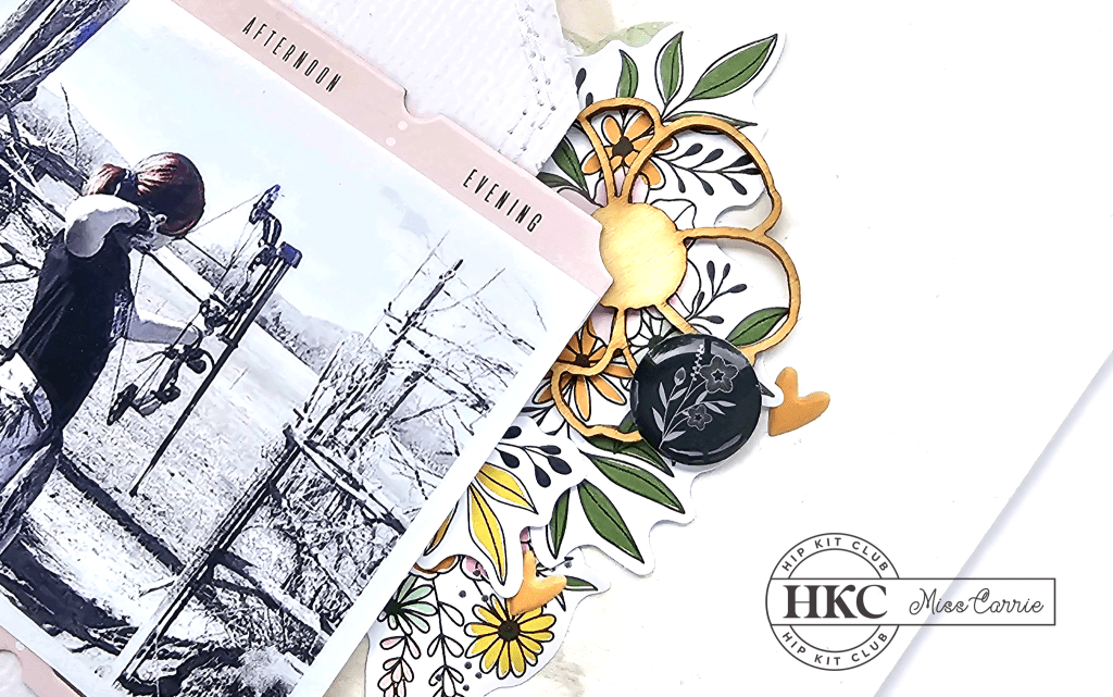 wood floral layered over bright floral die cuts - archery scrapbook page with mixed media background created with components from the May 2023 Hip Kit Club collection